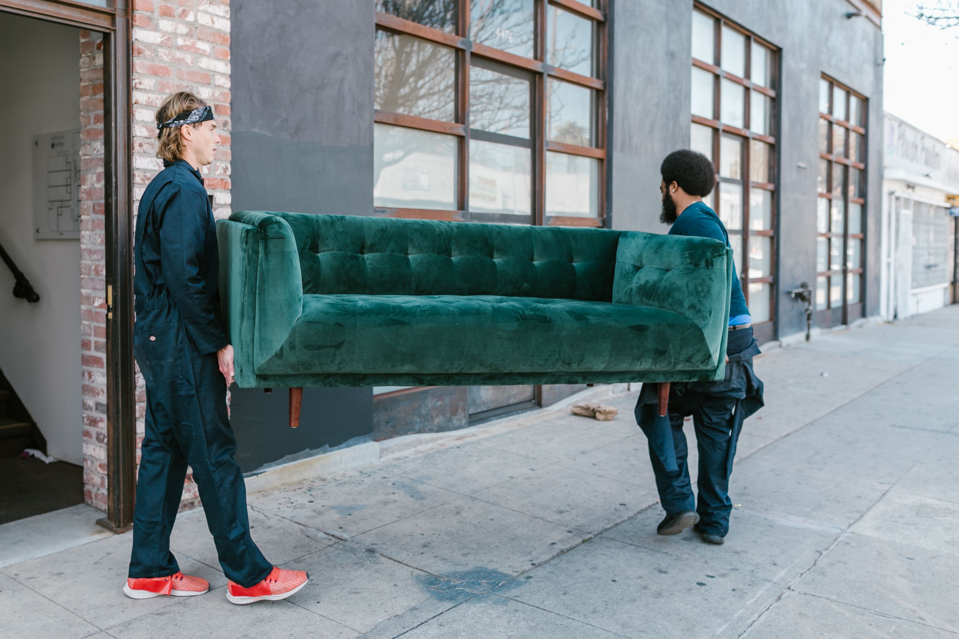 Professional movers carrying furniture